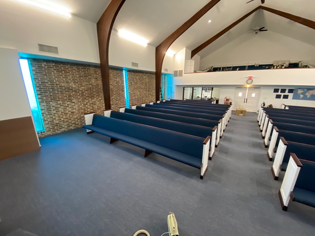 Front Side View of a new pew installation in Titusville, Florida from Woods Church Interiors